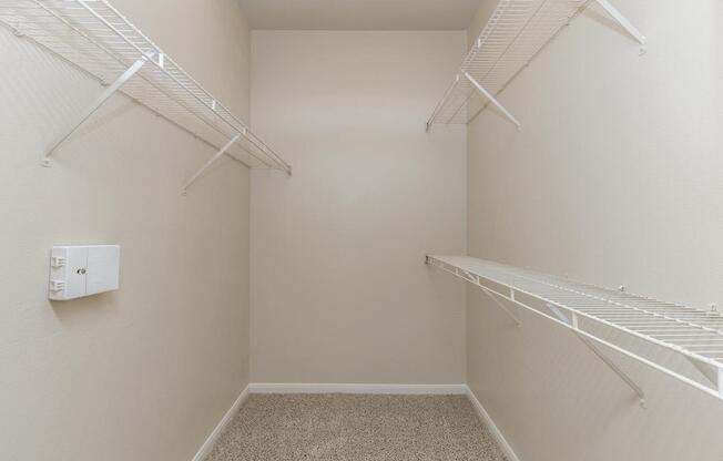 Walk-in closet with shelves and extra storage space at The AvenueÂ 