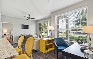 Kitchen Breakfast Bar and Living Room with Grey Hardwood Style Flooring