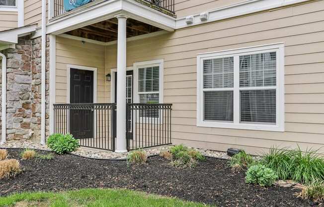 A house with a black door and window.