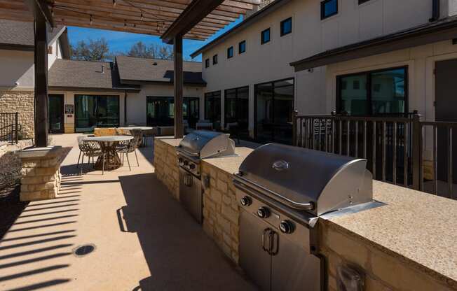 outdoor community area with grills for cooking at ironridge apartments