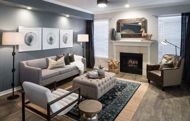 a living room with a fireplace and couches