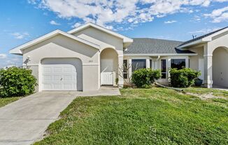 Cape Coral Duplex with Garage and Screened in Lanai