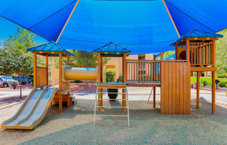 a playground at a park with a slide