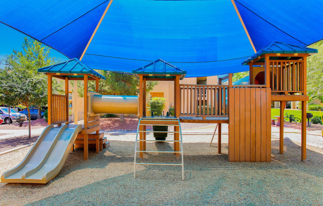 a playground at a park with a slide