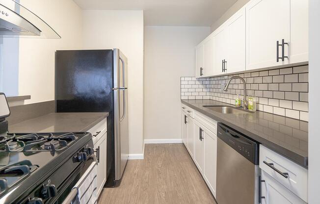 a kitchen with a stove top oven