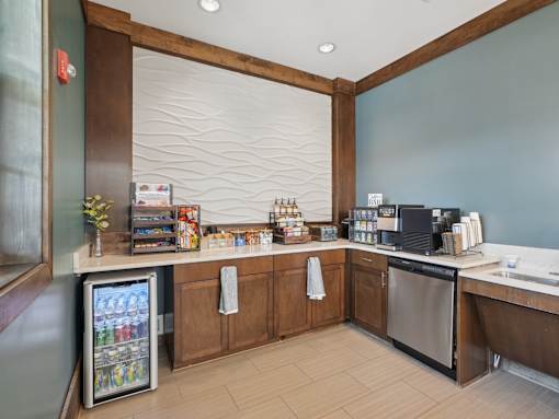Resident coffee bar and refreshment station at Village at Broadstone Station apartments in Apex, NC