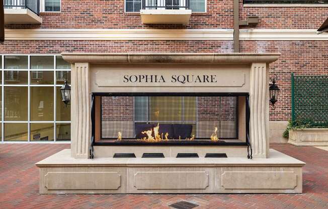 A fireplace with the words "Sophia Square" written above it.