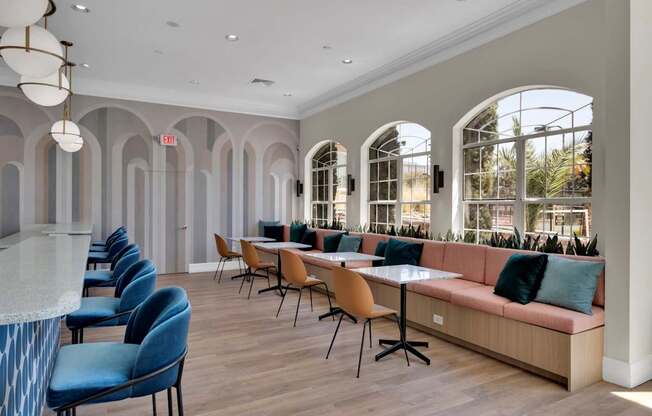 Clubhouse with a long couch and tables and chairs