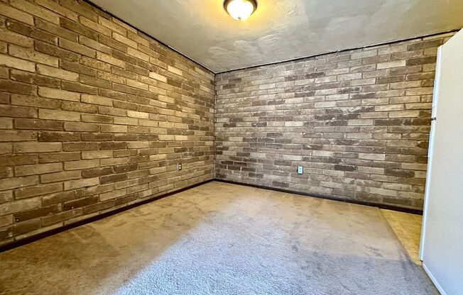 Cozy Studio with Beautiful Exposed Brick! Off-Street Parking! Call Now!