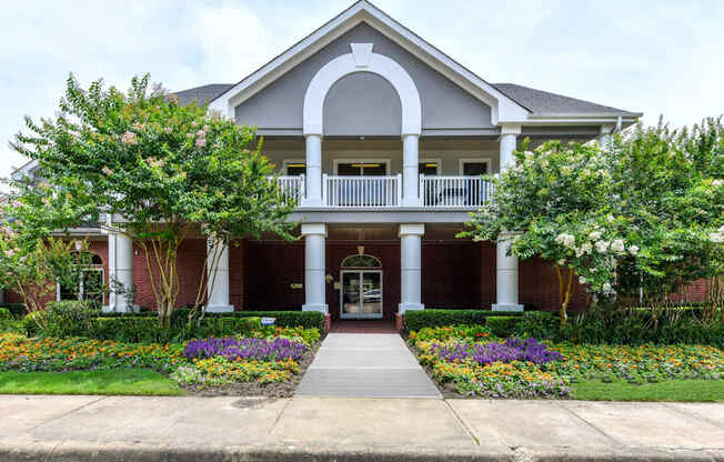 A house with a front porch and a well-kept garden.at Park at Forest Hill, Tennessee, 38125