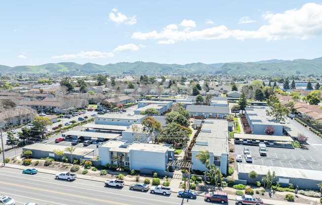 A view of a town with a lot of buildings and cars.