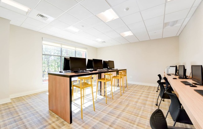 business center with computer stations and large windows at archer park apartments in southeast Washington dc