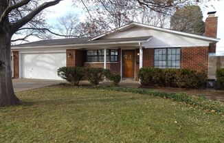 Charming Oasis: Stylish Home with Parquet Flooring and Spectacular Landscaping!