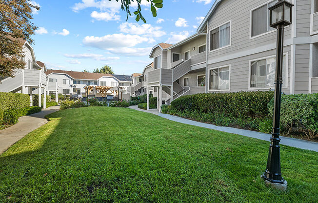 Romantic grass covered courtyard at Corbin Terrace Apartments.