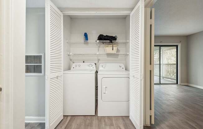 A laundry room with a washer and dryer.