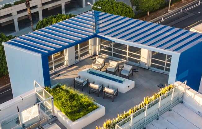 a rendering of a rooftop patio with a pool and a blue roof