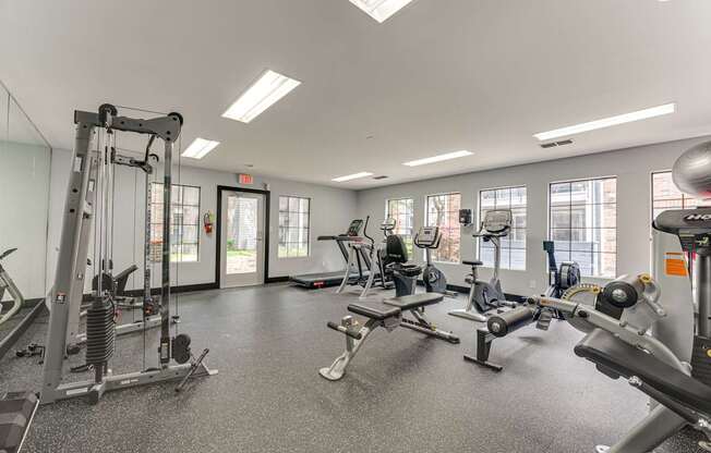A spacious gym with various exercise equipment.