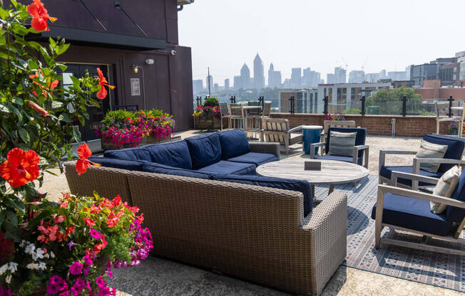an outdoor patio with a view of the philadelphia skyline
