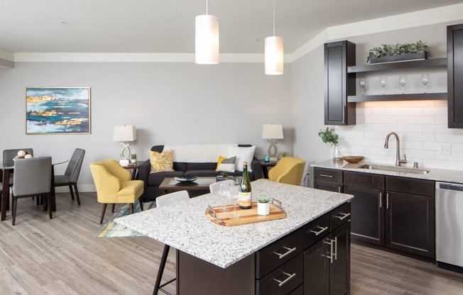 A modern kitchen with a dining table and chairs.