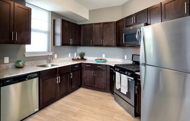 Fully Equipped Kitchen Includes Frost-Free Refrigerator, Electric Range, & Dishwasher at The Waverly at Neptune, Neptune, 07753