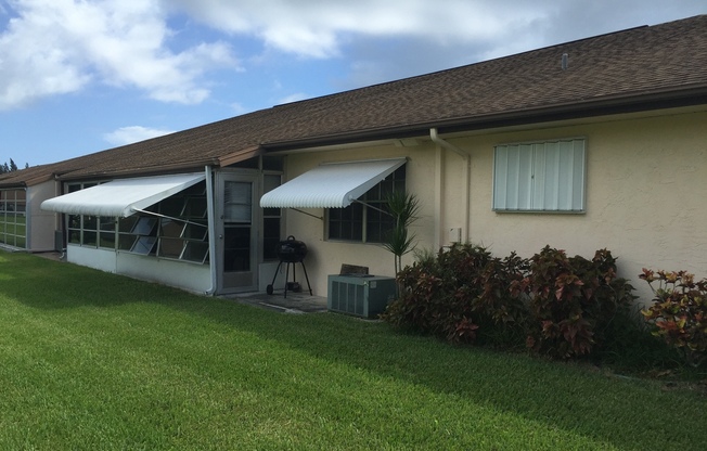 COMPLETELY RENOVATED 2 BEDROOM 2 BATH CONDO IN THE GROVE- 55+ GATED COMMUNITY IN FORT PIERCE