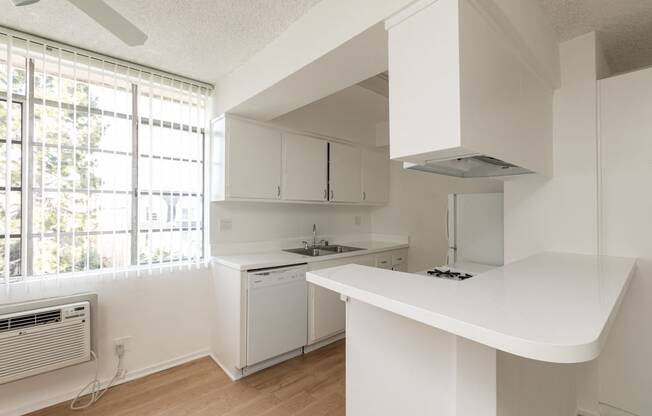 Kitchen with White Appliances and White Cabinets