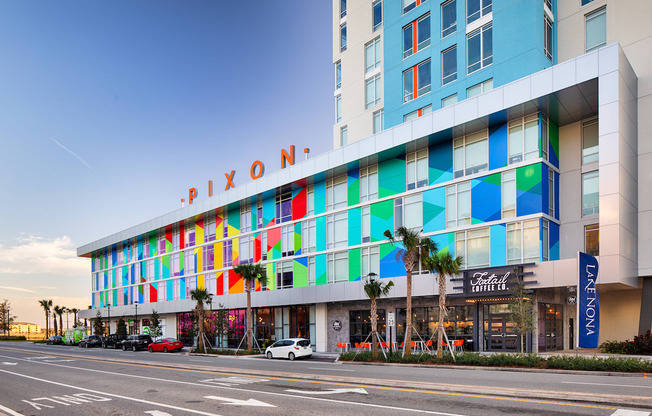 Front of Lake Nona Pixon with outside mural and illuminated sign at Lake Nona Pixon, Orlando, FL, 32827