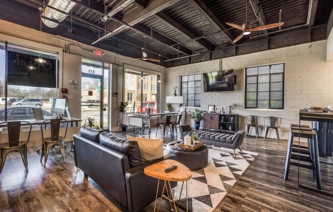 a living room filled with furniture and a large window