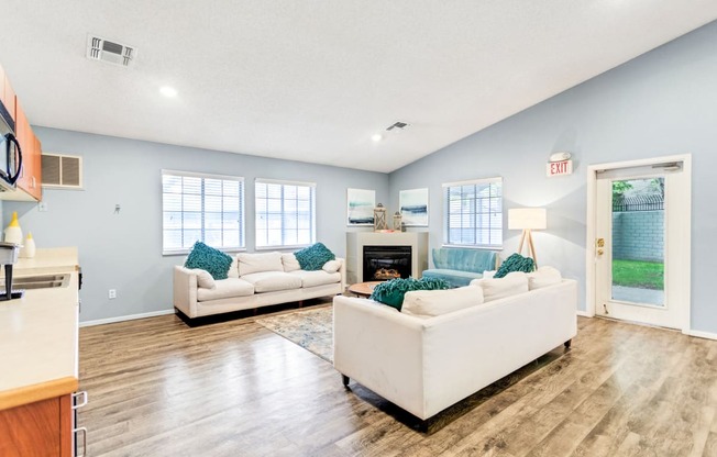 a living room with couches and a fireplace