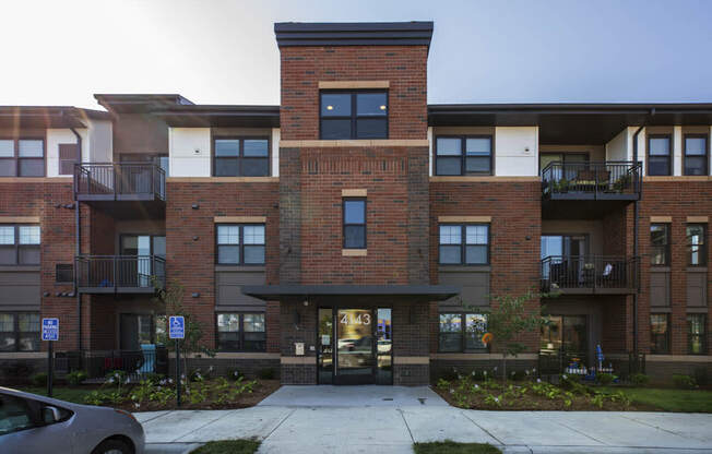 Exterior building view with controlled access entry at Ascend at Woodbury MN 55129 new luxury apartments