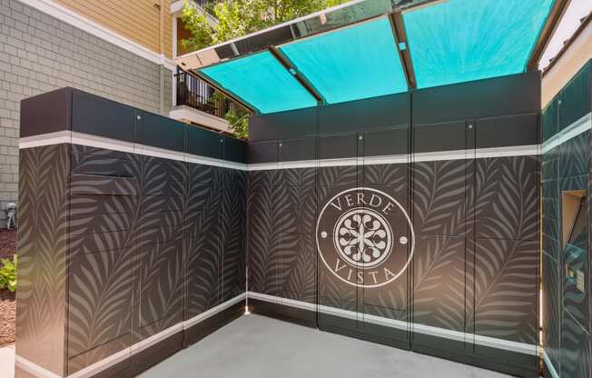 a patio with a perforated wall and a logo on it