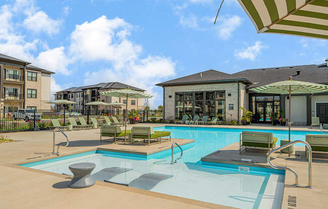 our apartments offer a swimming pool with chairs and umbrellas