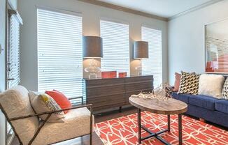 a living room with a couch and a table