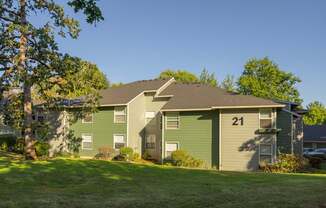 A green house with the number 21 on it.