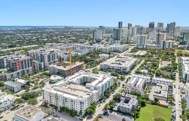 an aerial view of the city with tall buildings and skyscrapers