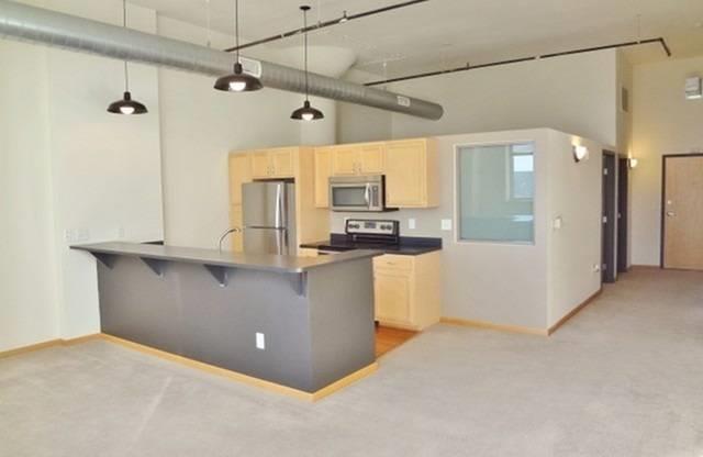 Modern Kitchen with appliances and cabinets at Boston Lofts, Wisconsin