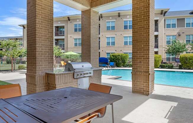 our apartments have a large patio with a grill and a swimming pool