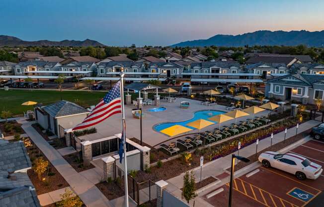 aerial view of pool, houses and mountains