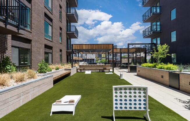 Take your fun to new heights on Modera Golden Triangle's rooftop gaming lawn. Enjoy open-air games, friendly competition, and stunning Denver views from above.