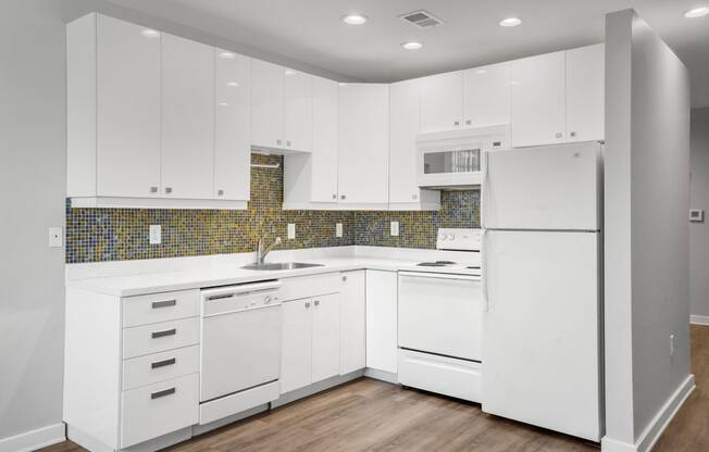 Our Apartment Kitchen with White Cabinets at Sleek Lofts Apartments in Denver, Colorado