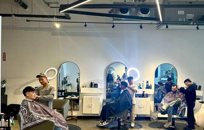 The Gray Area Salon giving haircuts to customers