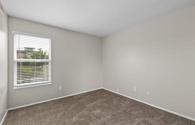 Bedroom with gray walls and a window with a blind at Creve Coeur, Creve Coeur, MO