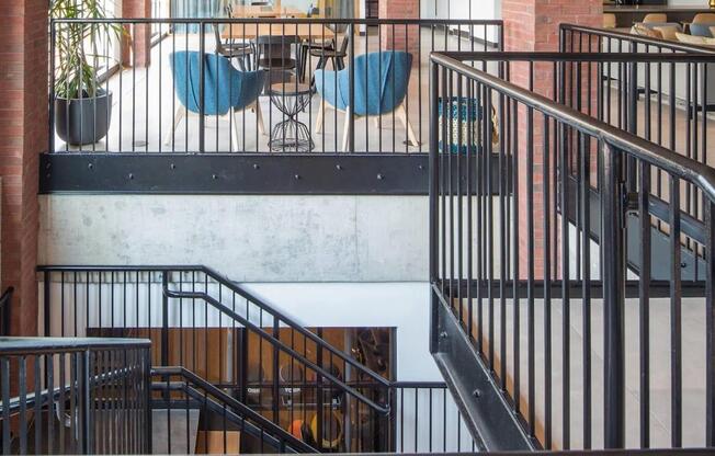 the interior of a building with stairs and a dining room