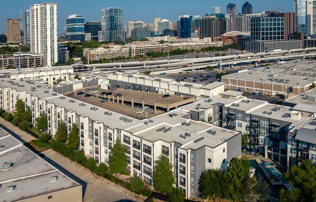 a view of the campus with the downtown skyline in the background