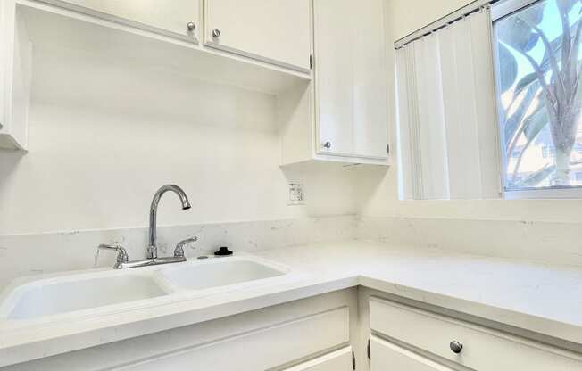 Kitchen with White Appliances and White Cabinets