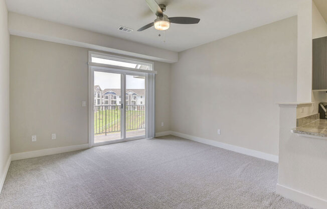 Living Room Leads To Private Balcony at Chase Creek Apartment Homes, Huntsville, AL, 35811