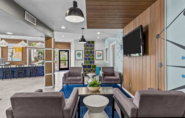 a living room filled with furniture and a flat screen tv