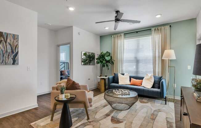 a spacious living room with a couch at Apex apartments in Colorado Springs, CO