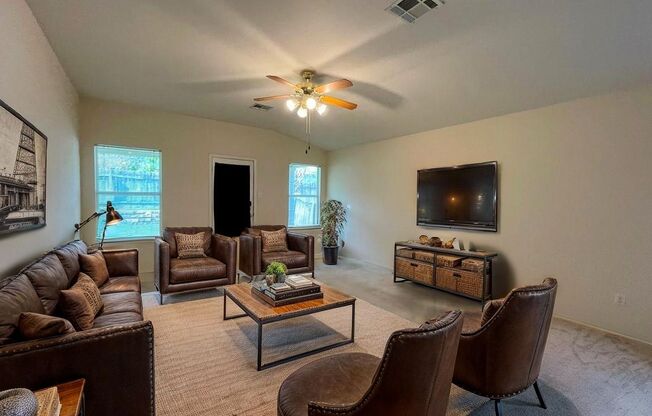 126 Salado Dr in Kyle is a charming single-story brick home nestled in the Silverado at Plum Creek community!