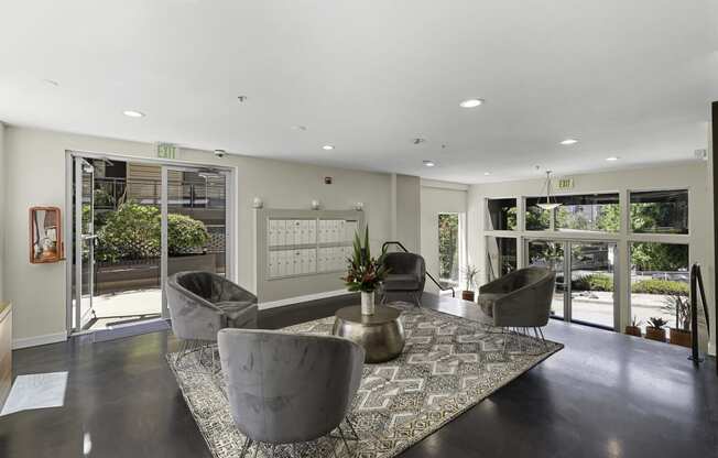 Resident Lounge Lobby filled with comfortable seating and  large windows for an open concept space at Illumina Apartment Homes, Seattle